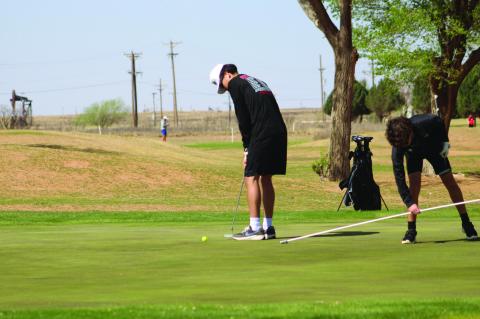 Brownfield’s JoeAnthony Mata watches his putt on the fifth green during the first round of the District 3-3A Championships on Monday at Yoakum County Golf Course. (LEE SCHEIDE | BROWNIELD NEWS)