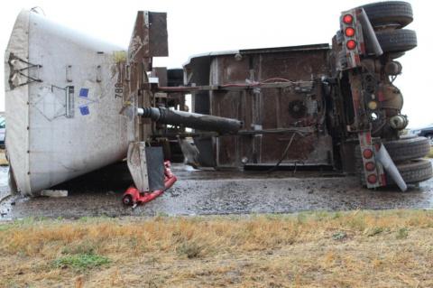 Semi-truck overturns, driver sent to hospital