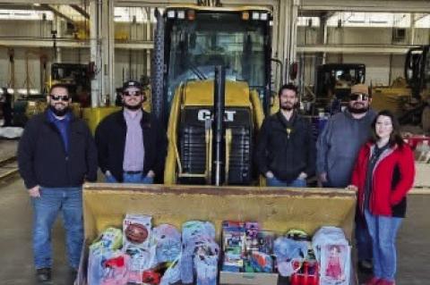 Students at Wellman-Union High School and employees at Warren Cat display the gifts collected to be donated to the Brownfield &amp; Terry County Goodfellows nonprofit organization. Goodfellows has been collecting gifts and donations from schools and busin