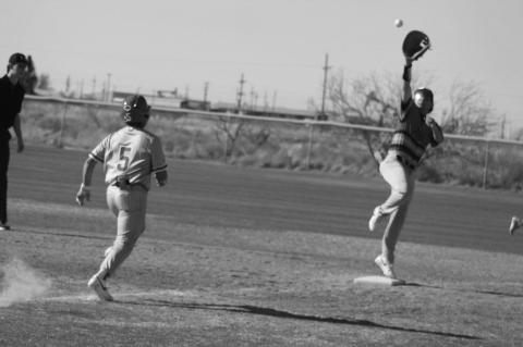 Brownfield first baseman Jayden Tijerina stays on the base as he reaches up for a high throw as Denver City’s Gavin Garcia (5) runs down the line during a District 3-3A game against Denver City on Tuesday in Denver City.