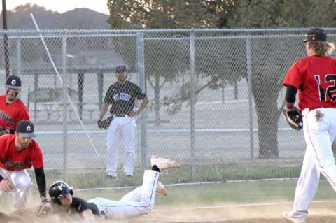 Cubs open district with a road win