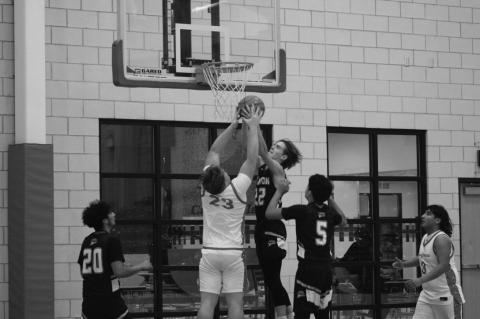 Loop’s Kaydan Stanfield (23) battles Meadow’s Korbin Young (22) for a rebound during a game at the Hermleigh Holiday Hoopapalooza on Thursday at Hermleigh High School.