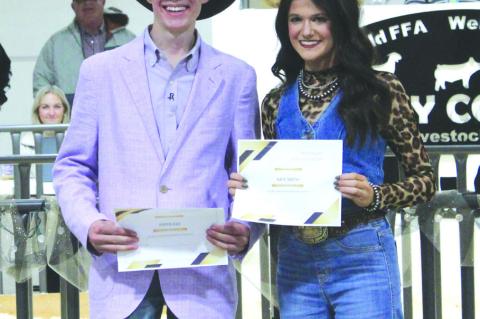 Ryder Day (left) and Kate Smith, both of Meadow, show off the scholarship certificates from the Terry County Livestock Association at the Terry County Livestock Show on Jan. 11 at the Terry County Show Barn
