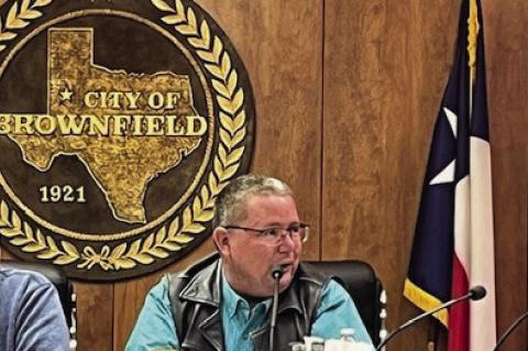 Mayor Eric Horton (left) and council member Marshall Martell (right) listen as City of Brownfield City Manager Jeff Davis talks about Proposition A, which allows the city to change from a Type A to a Type B Economic Development Corporation sales tax. (Lee