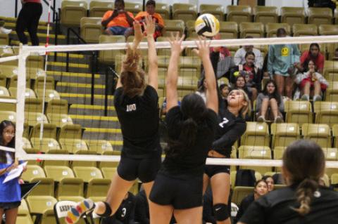 A pair of Brownfield players leap to block a kill attempt against Fort Stockton during a scrimmage at the Andrews Performance Center Friday in Andrews. (LEE SCHEIDE|BROWNFIELD NEWS)