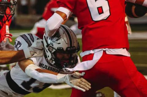 Brownfield quarterback Ben Estrada (6) fights for extra yards during the season opener against Muleshoe on Friday in Muleshoe.