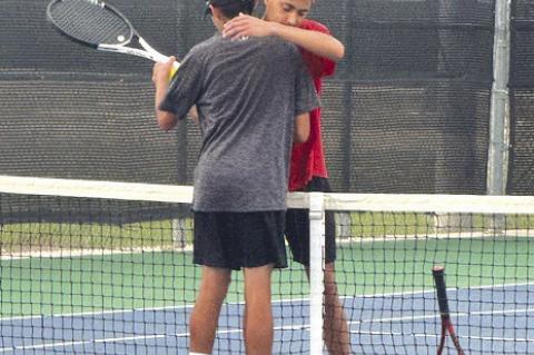 Brownfield's John Fields shakes hands with Cub Quintero of Corpus Christi London after Fields' 6-0, 6-0 victory in the first round of the Class 3A State Tennis Tournament on Thursday at Anne Marie Tennis Center in San Antonio. (COURTESY PHOTO)
