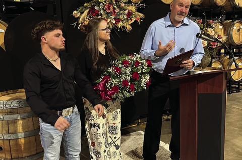 Gage McPherson (left) and Courtney McPherson listen as Zayne McPherson speaks after winning the CItizen of the Year award at the Brownfield Chamber Banquet &amp; Award Ceremony at The Armory on Thursday in Brownfield.