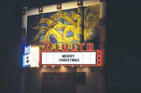 The Marquee at the theater welcomes guests as they drive through town, and parade participants in the annual Christmas Light Parade.