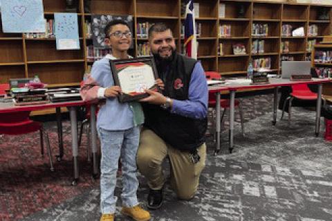 Amir Willis of Oak Grove Elementary poses with Board of Trustees member Matt Valdonado after Willis was honored as the school district’s Student of the Month at the monthly school board meeting on Jan. 13 at Brownfield Junior High.