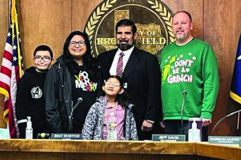 Stephen Ramon (center) and his family, along with City of Brownfield Mayor Eric Horton (right) pose for a picture after Ramon was honored as the City of Brownfield Employee of the Quarter at the city council meeting on Dec. 19.