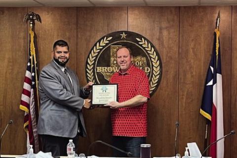 Brownfield PD Lieutenant Matt Valdonado (left) and Mayor Eric Horton pose for a picture after the Brownfield City Council recognized Valdonado’s selection as the Best Local FIrst Responder in the Best of Terry County 2024 poll run in the Brownfield News