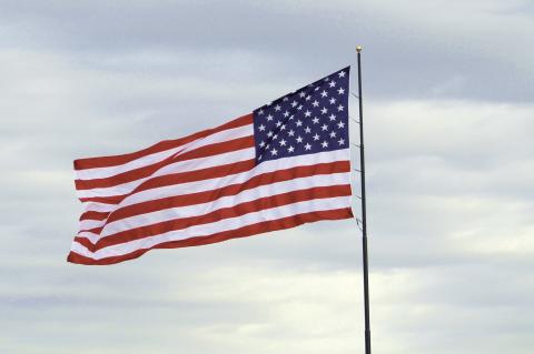 The City of Brownfield unfurled its new American flag during a ceremony on Thursday morning at Hamilton Park. The flag measures 30 feet by 60 feet and will remain alo_ to greet visitors coming into the city from the north. (Lee Scheide | Brownfield News)