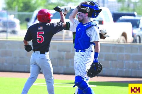Brownfield’s Andrew Valenzuela is congratulated after reaching first base during the Black-Gold Sports Senior Game at Joe Spikes Fields on Saturday in Lamesa.