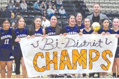The Meadow girl’s basketball team shows off the Class 1A Division I bi-district trophy after defeating Lenorah Grady, 33-27, on Monday at Lamesa High School. The Lady Broncos advanced to face Spur in the area round on Friday at Tahoka High School. (ERIC