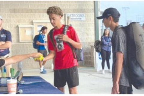Brownfield's John Fields (center) checks in, along with Corpus Christi London's Cub Quintero, before their first-round match at the Class 3A State Tennis Tournament on Thursday at the Anne Marie Tennis Center in San Antonio. (COURTESY PHOTO)