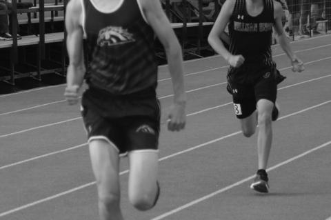 Meadow’s Kyle Woodard (front) sprints the final meters to hold off Cam Arendall of Wellman- Union in the Boys 1,600 at the District 5-1A Championships on Wednesday at Wellman- Union High School.