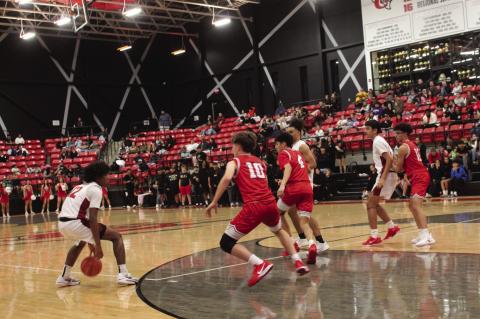 Brownfield’s Jeron Lawrence (12) looks for any opening to drive to the basket as Denver City’s Kirk Padgett (10) defends during a District 3-3A contest on Tuesday at The Pit.