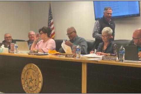 Commissioners Open Sealed Bids for Trucks