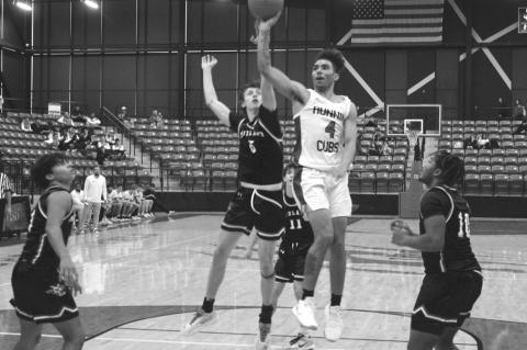 Brownfield’s Quavience Busby (4) shoots as Midland Christian’s Kohl Bremerman (5) defends during a game at the Hoopin’ Cubs Classic on Thursday at Brownfield.