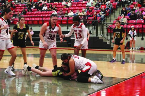 Brownfield’s Maya Martinez (31, right) wrestles with Lamesa’s Mariela Gonzales (24) during a District 3-3A game on Friday at The Pit in Brownfield.
