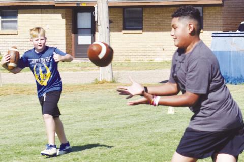 Learning football skills at camp