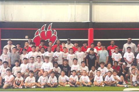 Campers and Brownfield High coaches and athletes pose for a photo inside the Cubs’ indoor practice facility last week. The final day of the camp was postponed and will be made up on June 12 from 5-7 p.m. (COURTESY PHOTO|BROWNFIELD ISD)