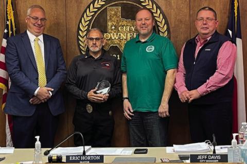 Brownfield Chief of Police Chris Kotzur (from left), 2024 City of Brownfield Employee of the Year Rick Guerra, Mayor Eric Horton and City Manager Jeff Davis after Guerra was recognized at a city council meeting Thursday. (Lee Scheide | Brownfield News)
