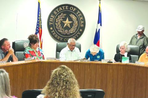 JackiePate,TerryCountySoilandWaterConservationDistrict ClerksignedaproclamationalongwiththeTerryCountyCommissioners Court recognizing Soil and Water Conservation Week (photos by News staff)