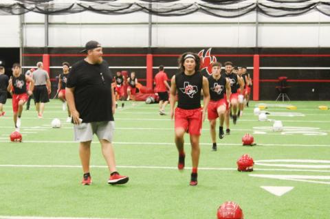 Brownfield football opens with midnight conditioning