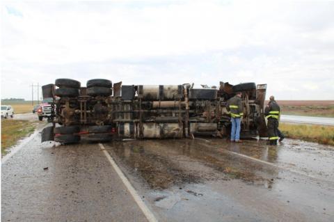 Semi-truck overturns, driver sent to hospital