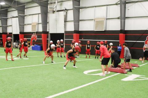 Brownfield football opens with midnight conditioning