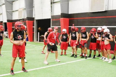 Brownfield football opens with midnight conditioning