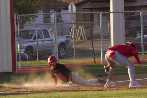 Brownfield’s Asiel Morin (3) looks toward the umpire after sliding safely into third base as Stanton’s Gage McGown attempts to make the tag during a District 3-3A game against Stanton on Monday at Brownfield.