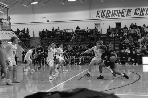 Brownfield’s Jeron Lawrence (12) is denied the lane by Bushland’s Tagg Thrush (0) as a pair of Falcons close in to help on defense during a Class 3A Division I area playoff game on Friday at the Rip Griffin Center in Lubbock. (Lee Scheide | Brownfield