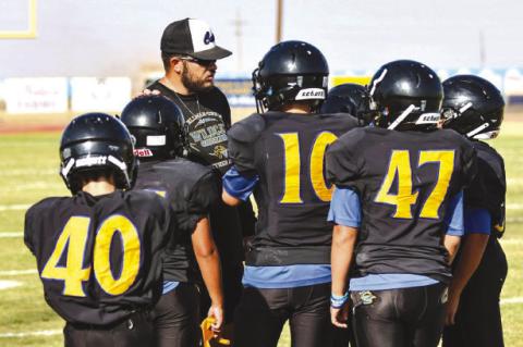 Wellman-Union coach Brett Labadie works with players during the 2024 season. Labadie, a 2015 graduate of Petersburg High School, was hired as the Wildcats head coach in April (COURTESY PHOTO/BRETT LABADIE)