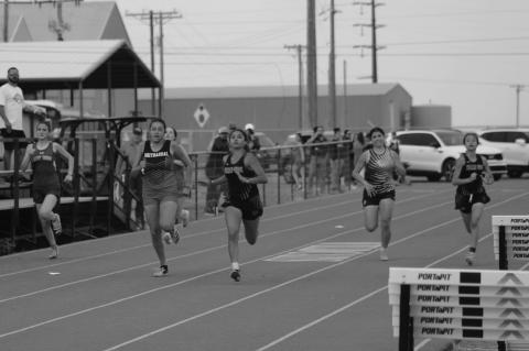 Wellman-Union’s Azayla Mercado leads the field down the home stretch in the Girls’ 200-meter day at the District 5-1A Championships on Wednesday at Wellman-Union High School. (Lee Scheide | Brownfield News)
