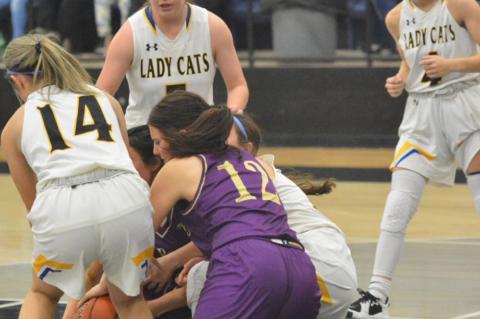 Broncos and Wildcats split in district