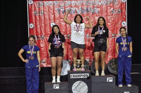 Brownfield’s Angel Gurrea stands on the top of the podium after winning the 123-pound title at the 2025 Texas High School Women’s Powerlifting Association state championship meet on Thursday in Edinburg. Gurrea was also named the Light Platform Best L