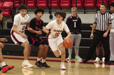 Brownfield’s Braylon Bruno (10) dribbles around a screen set by teammate JoeAnthony Mata (0) during a nondistrict game against Lubbock Coronado on Tuesday at Brownfi eld. (LEE SCHEIDE | BROWNFIELD NEWS)