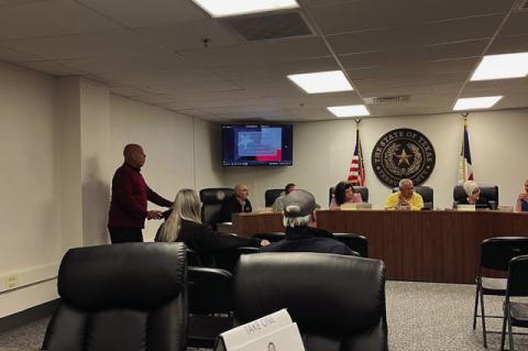 David Casarez (left) speaks to the Terry County Commissioners Court in a presentation about the Terry County Senior Center. (LEE SCHEIDE|BROWNFIELD NEWS)