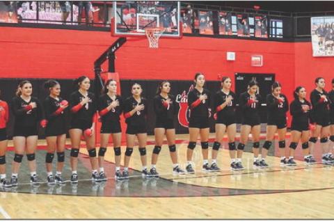 The Brownfield volleyball team stands on the back line as the national anthem is played before its District 3-3A match against Lamesa on Saturday at The Pit. (COURTESY PHOTO|BROWNFIELD ISD)