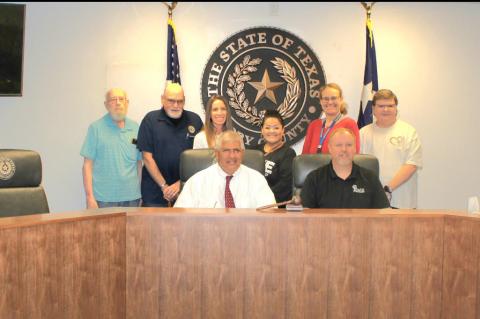 Terry County Judge Tony Serbantez and Brownfield Mayor Eric Horton sign a National Suicide Prevention Week proclamation Tuesday at the county courthouse. (Photo by Lupe Perez)