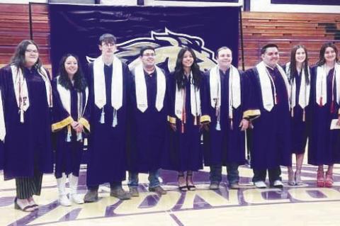 Earning their graduation stoles