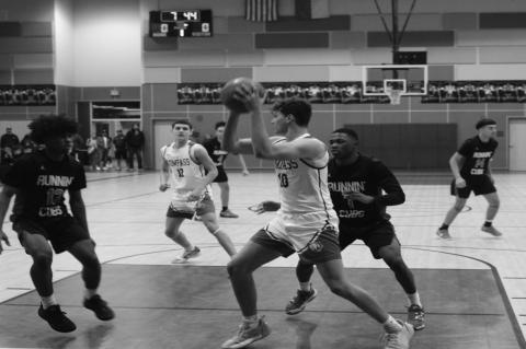 Brownfield’s Jeron Lawrence (12) and Kameron Gibson (1) pressure Compass Academy’s Liam Gahr (10) during a District 3-3A game on Dec. 20 at Compass Academy in Odessa.