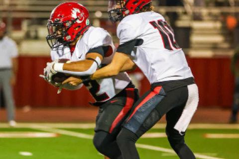 Brownfield running back Joby Rodriguez (2) takes the ball from quarterback Braylon Bruno (10) during a District 2-3A Division I game against Denver City at Mustang Stadium on Friday in Denver City. (COURTESY PHOTO|BROWNFIELD ISD)