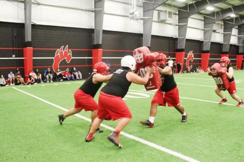 Brownfield football opens with midnight conditioning