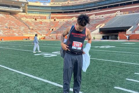 Brownfield's Quavience Busby stands on the turf at Darrell Royal Stadium at the University of Texas before competing at the2025UILClass3AStateTrackandFieldChampionshipson Thursday in Austin. (BROWNFIELD ISD PHOTO)