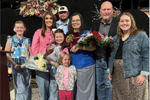 Judy Besler (center) is joined by her family after being named the Business Leader of the YEar at the Brownfield Chamber of Commerce’s annual awards banquet on March 13 at the Armony. (COURTESY PHOTO)