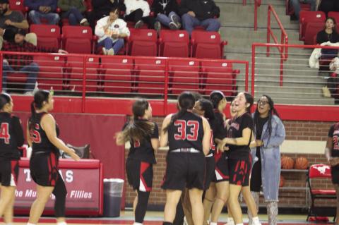 The Brownfield girl’s basketball team celebrates after defeated Denver City in a District 3-3A game on Tuesday at Dag Azum Gymnasium in Denver City. (Lee Scheide | Brownfield News)
